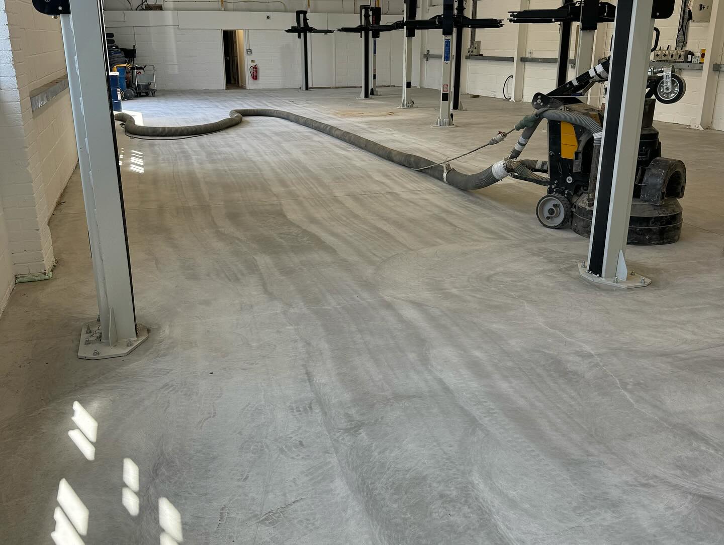 Taylors Service Center Before - Worn concrete floor